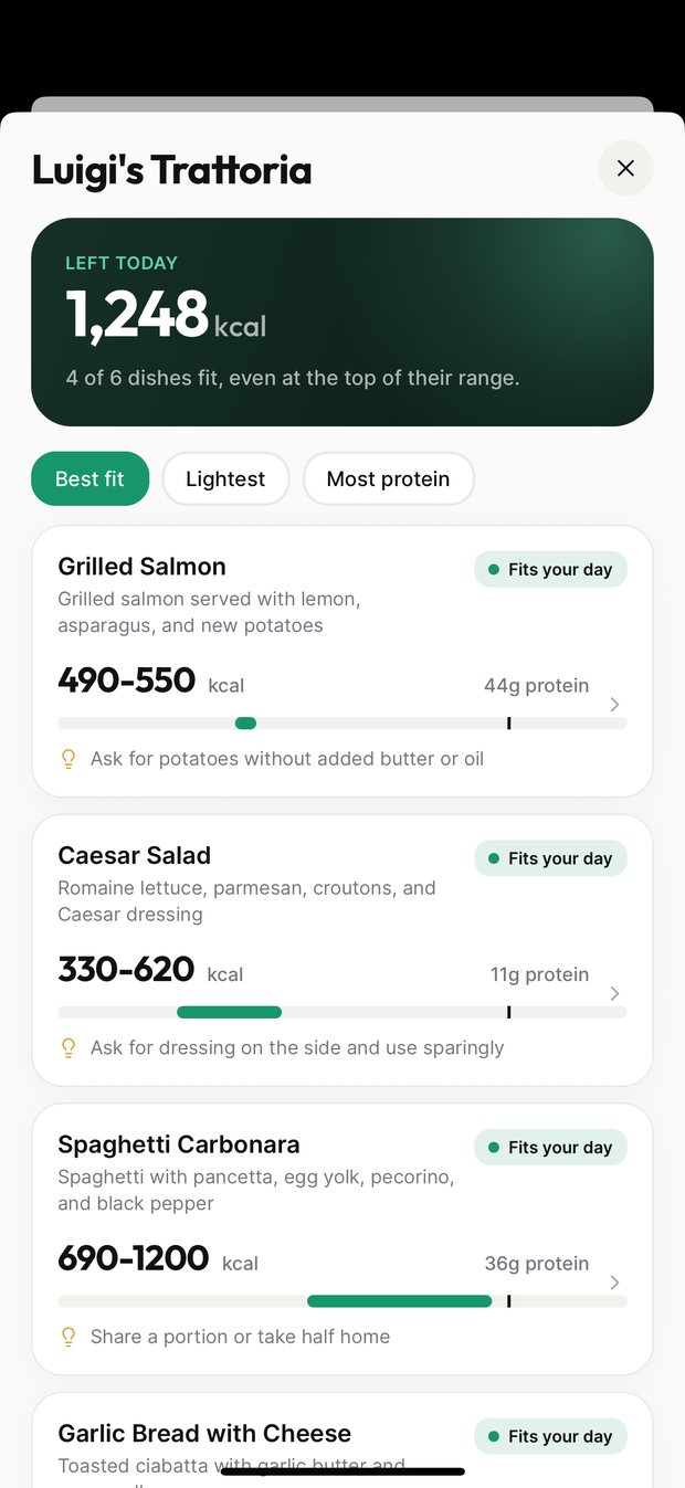 A scanned Italian restaurant menu with each dish showing a calorie range and whether it fits the day